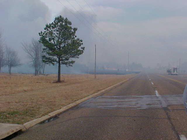 Smoke crossing the road.